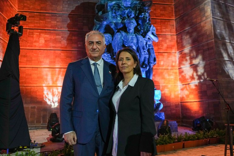 Son of Iran's last sha, Iran's exiled crown prince Reza Pahlavi, left, and Israeli Intelligence Minister Gila Gamlielpose for photographers ahead of the opening ceremony of the Holocaust Martyrs and Heroes Remembrance Day at Yad Vashem Holocaust Museum