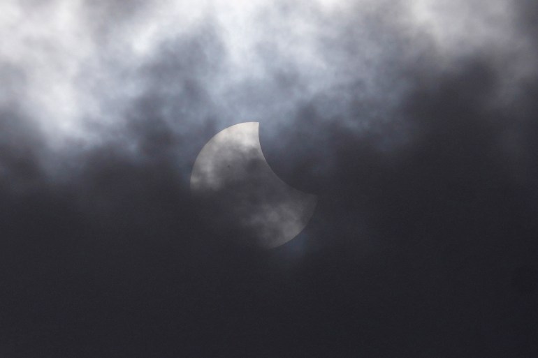 Partial solar eclipse in Jakarta. It is partly obscured by cloud