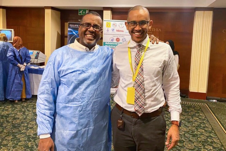 This image provided by Dr. Mohamed Eisa shows Dr. Bushra Ibnauf Sulieman, a Sudan-born American citizen, left, posing for a photo with Dr. Mohamed Eisa. 