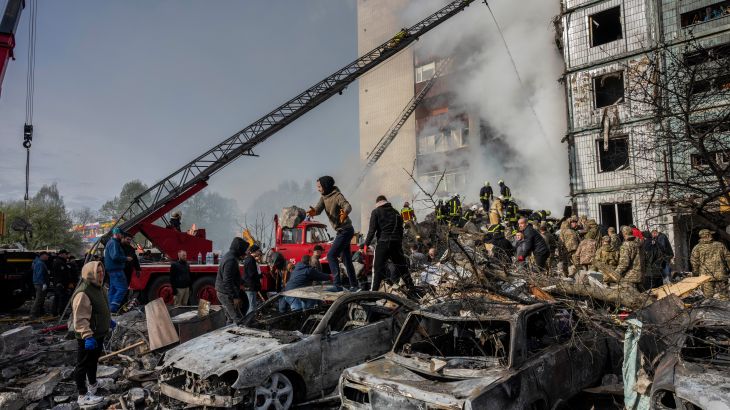 Following a Russian attack, first responders remove rubble at a residential building in Uman, central Ukraine, Friday, April 28, 2023. (AP Photo/Bernat Armangue)