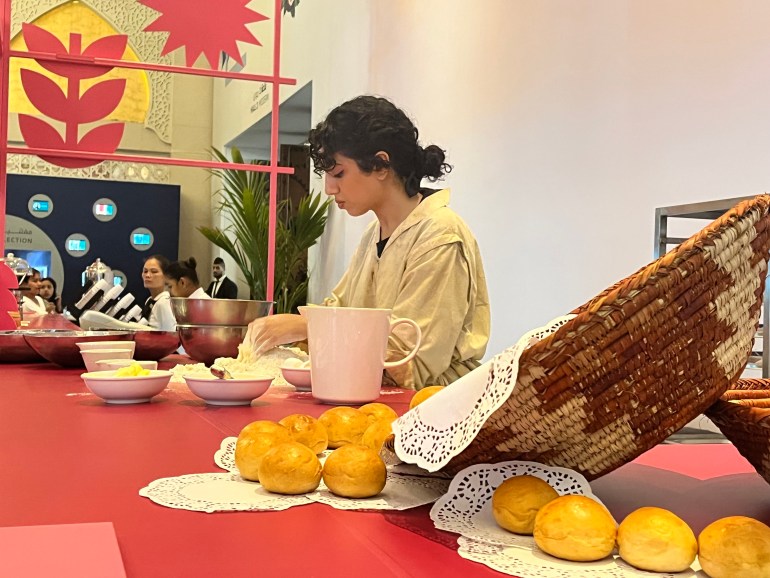 Almatrooshi making bread during 'The Alphabetics of the Baker' at Art Dubai