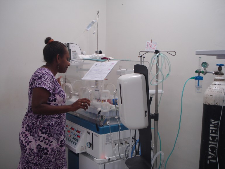 Dr Thyna checks on an infant in an incubator at the neonatal ward in Vanuatu's main hospital
