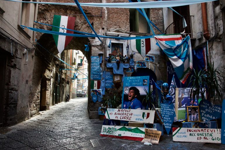 Umberto Iannaccone set up a Napoli shrine in a corner between two buildings in Naples’ historic centre. Shrines and tributes to the Napoli team, especially Maradona, are set up across the city in preparation for Napoli’s win this coming Sunday.