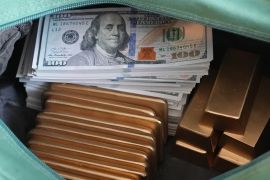 Gold and dollars in a bag