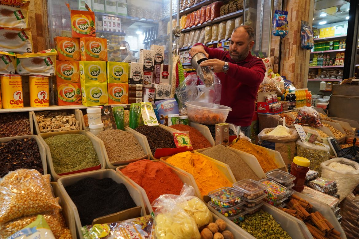 "There's something about Mosul... we (shop owners) all cut our prices to help people in Ramadan. There are also many free food baskets that go out to the poor from this market. In my opinion, it is the strongest city for social solidarity in the Arab World," Muhammed Ghanem said. [Ismael Adnan/Al Jazeera]