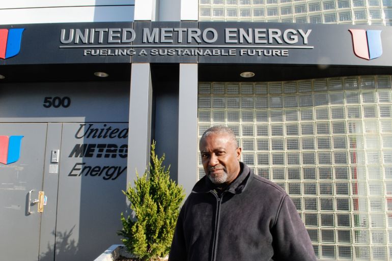 A photo of Andre Soleyn outside the United Metro Energy Corporation (UMEC) building.