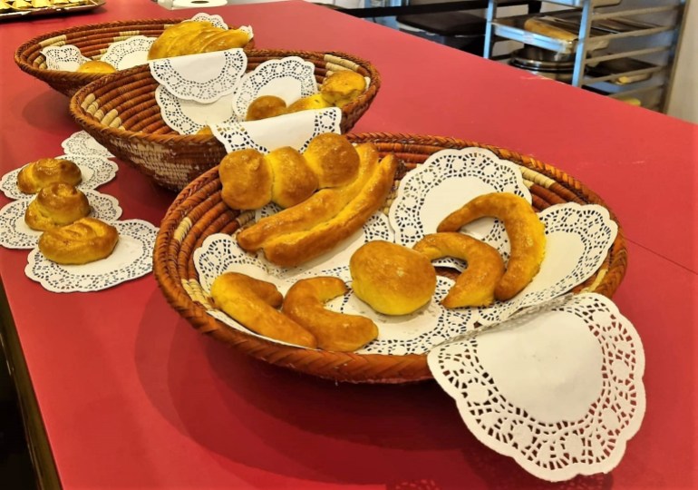 Three baskets with bread in various shapes