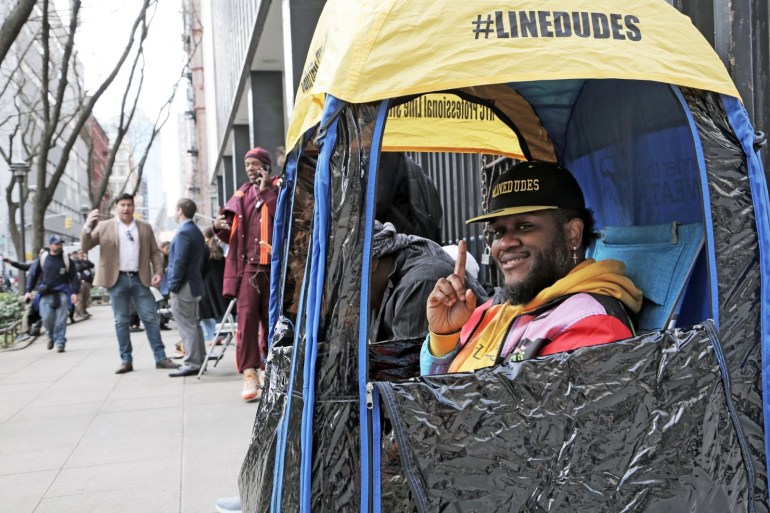 Adonis Porch, 36, braved the brisk spring weather to hold a spot in line for a New York news crew