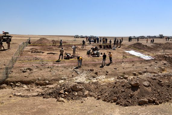 epa09267156 Iraqi forensic personnel inspect a site believed to be a mass grave in the Al-Humaydat village, western Mosul city, 500 km north of Baghdad, Iraq, 13 June 2021. Nineveh's Governor, Najm Al-Jubouri announced that "Two mass graves containing about 550 bodies of victims killed and buried by the so-called Islamic State (IS) group, have been found near the Government Badush prison in Mosul, and victims might be the personnel in charge of the prison security among them women". Badush prison was attacked by IS in June 2014, some 650 Shiite inmates had been killed, the authorities knew of the grave since 2017 when local inhabitants indicated its existence, but wanted to make sure to have the necessary forensic teams capacity to properly identify the victims. Mosul region was under IS control between 2013 and 2017. EPA-EFE/AMMAR SALIH