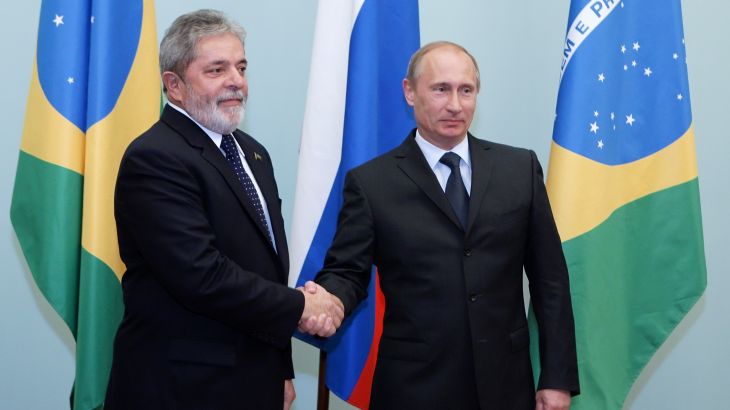 Brazil's President Luiz Ignacio Lula da Silva (L) shakes hands with Russia's Prime Minister Vladimir Putin as they meet in Moscow May 14, 2010. Brazilian President Luiz Inacio da Lula Silva vowed on Friday to do his best on a forthcoming visit to Tehran to persuade Iran of the need for dialogue over its nuclear programme. REUTERS/Ria Novosti/Pool/Alexei Druzhinin (RUSSIA - Tags: POLITICS)