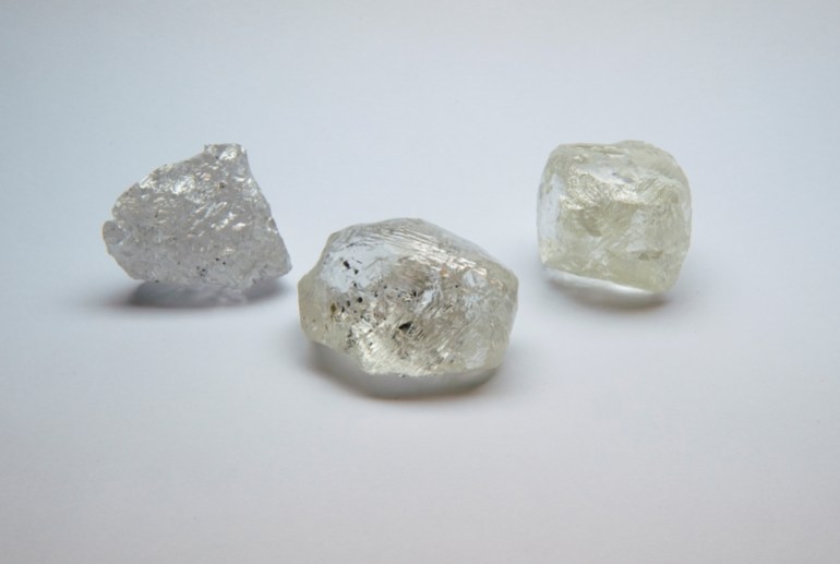 Russian rough diamonds. There are three large rocks.