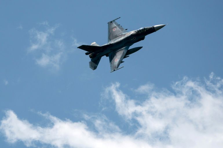 An F-2 fighter jet flies during a live-fire exercise conducted by the Japan Ground Self-Defense Force