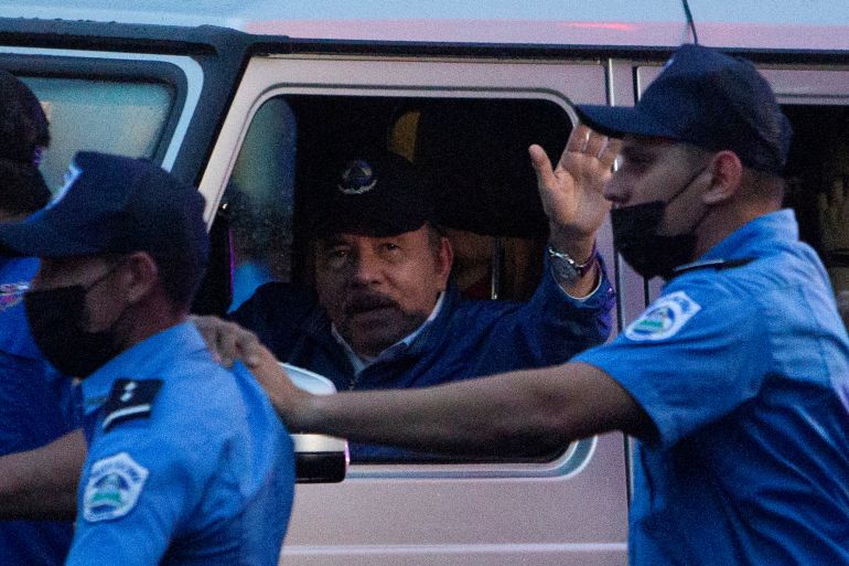 icaragua's President Daniel Ortega arrives as he waves to supporters before attending an event to mark the 43rd anniversary of the Sandinista Revolution, in Managua