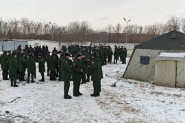 Russian conscripts called up for military service during the annual autumn draft meet at a gathering point before their departure for garrisons, in Omsk, Russia.