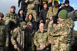 Ukrainian personnel take pictures with British Defence Secretary Ben Wallace during a training at Bovington Camp, near Wool in southwestern Britain, February 2023
