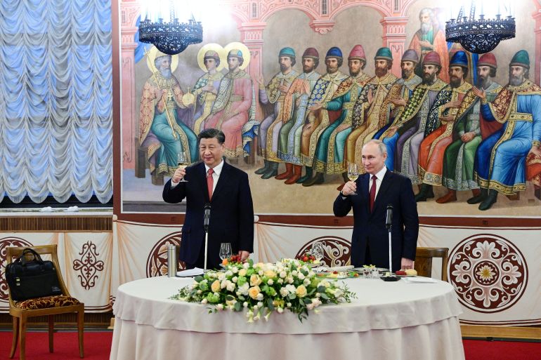 Russian President Vladimir Putin and Chinese President Xi Jinping attend a reception at the Kremlin in Moscow, Russia March 21, 2023. Sputnik/Pavel Byrkin/Kremlin via REUTERS ATTENTION EDITORS - THIS IMAGE WAS PROVIDED BY A THIRD PARTY.