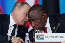 Russia's President Vladimir Putin speaks with South African President Cyril Ramaphosa at the first plenary session as part of the 2019 Russia-Africa Summit at the Sirius Park of Science and Art in Sochi, Russia, October 24, 2019.
