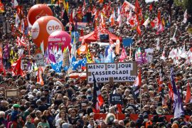 People attend the traditional May Day march against the French pension reform law and for social justice, in Nantes, France