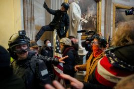 In the halls of the US Congress, protesters rush forward, with some clashing with police, some climbing on the decor, and others rushing forward