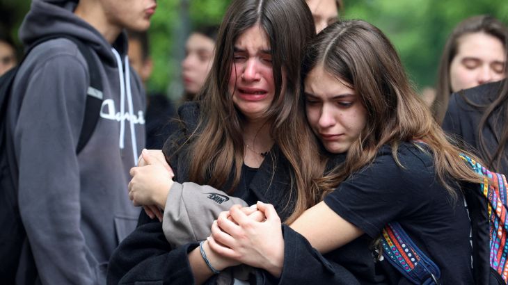 People react as they pay tribute following a school mass shooting, after a boy opened fire on others, killing fellow students and staff, in Belgrade, Serbia May 4, 2023. REUTERS/Zorana Jevtic TPX IMAGES OF THE DAY