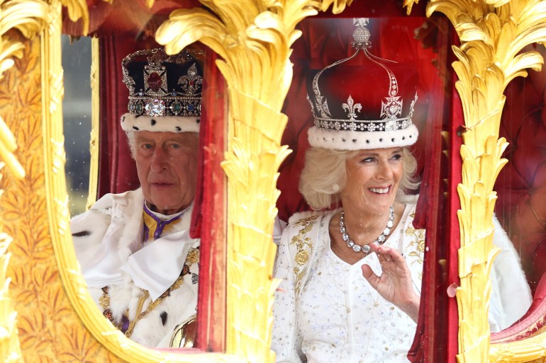 Britain's King Charles and Queen Camilla travel from Westminster Abbey in the Gold State Coach, following their coronation ceremony, in London, the UK.