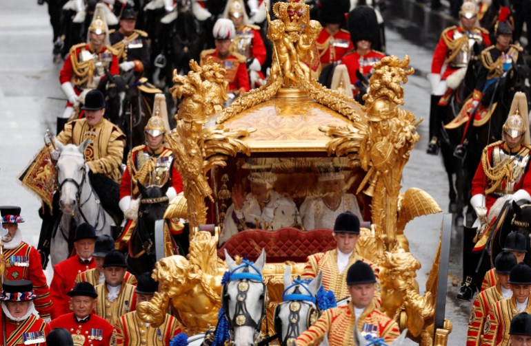 Britain's King Charles and Queen Camilla travel in the Gold State Coach