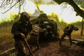 Ukrainian service members of the 10th Mountain Assault Brigade 'Edelweiss' fire a D-30 howitzer towards Russian troops at a position in a front line, amid Russia’s attack on Ukraine, near the town of Soledar, Donetsk region, Ukraine, May 6, 2023.