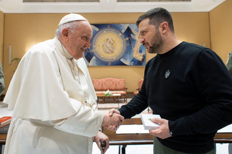Pope Francis shakes hands with Ukrainian President Volodymyr Zelenskiy, at the Vatican, May 13, 2023. Vatican Media/­Handout via REUTERS ATTENTION EDITORS - THIS IMAGE WAS PROVIDED BY A THIRD PARTY.