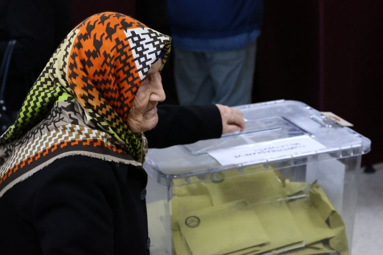 A woman casts a ballot at a polling station during Turkish presidential and parliamentary elections, in Ankara