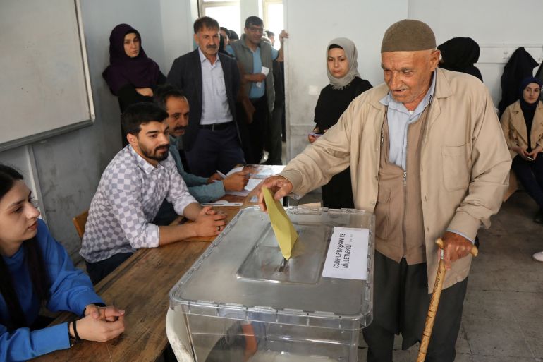 A man casts his ballot during Turkish presidential and parliamentary elections in Diyarbakir, Turkey,