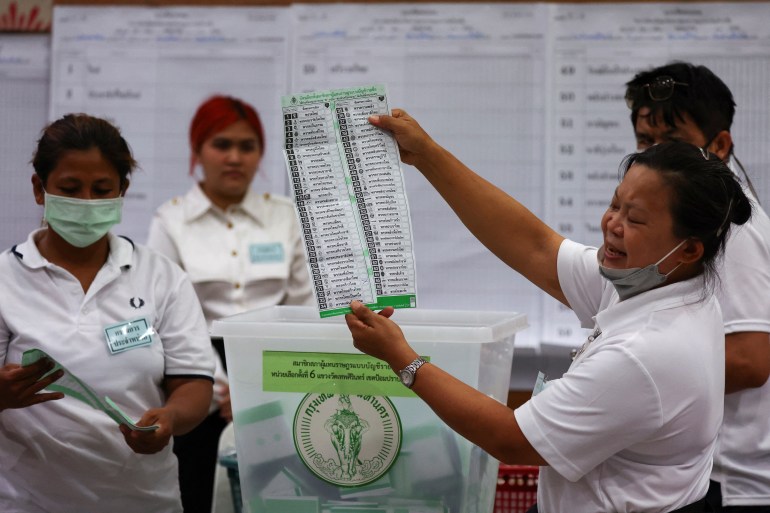 Workers count votes as the polling stations close on the day of the general elections in Bangkok, Thailand, May 14, 2023.