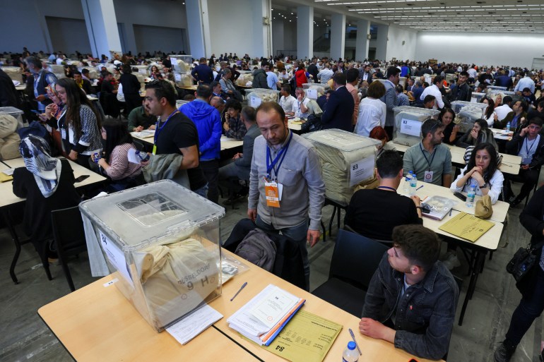 Election officials wait to count votes from abroad on the day of Turkey's presidential and parliamentary elections.