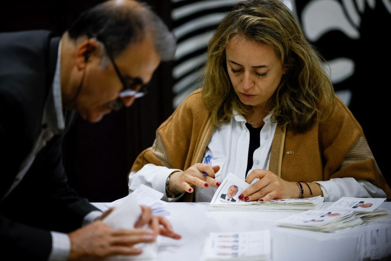 Officials count votes on the day of the presidential and parliamentary elections in Turkey.