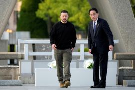 Ukrainian President Volodymyr Zelenskyy and Japanese Prime Minister Fumio Kishida walking together at the Hiroshima Peace Park
