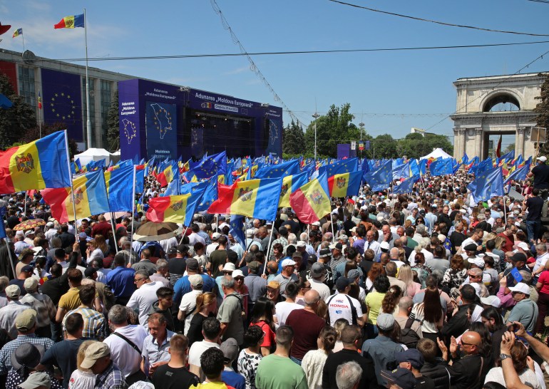 People wave flags of European Union and Moldova during a rally to support the European path of the country, in Chisinau, Moldova May 21, 2023. REUTERS/Vladislav Culiomza