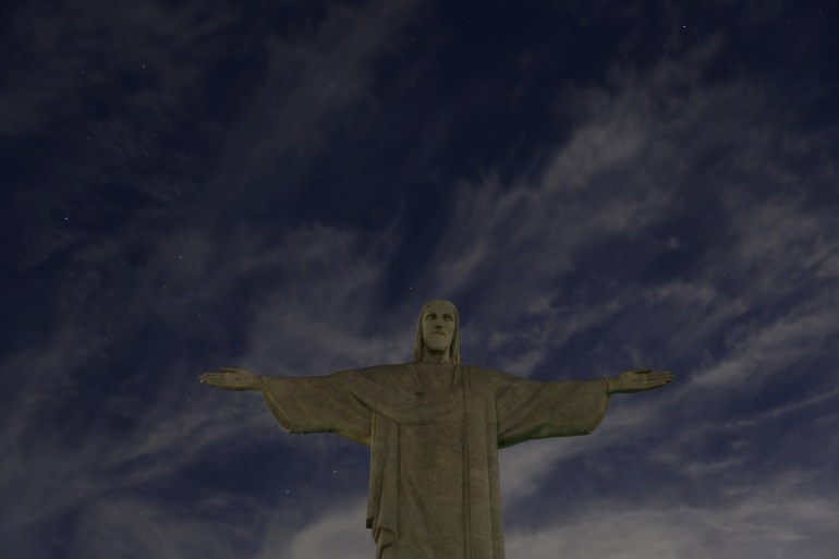 The Christ the Redeemer has its lights turned off to condemn "racist attacks" on Brazilian soccer star Vinicius Jr in Rio de Janeiro, Brazil May 22, 2023.