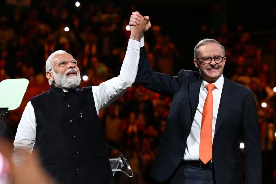 India's Prime Minister Narendra Modi and Australia's Prime Minister Anthony Albanese attend a community event at Qudos Bank Arena in Sydney, Australia