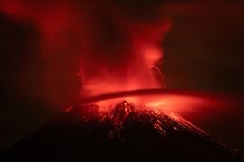 The Popocatepetl volcano erupting, as seen from San Nicolas de los Ranchos, in Puebla state. [Armando Vega/Reuters]