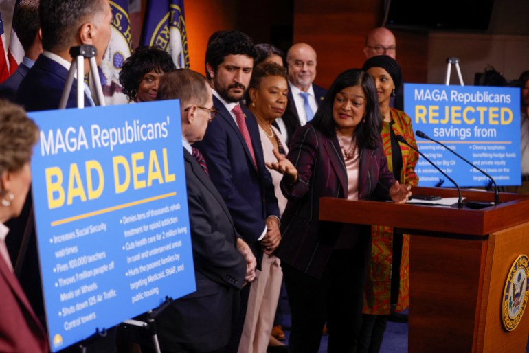 U.S. Representative Pramila Jayapal (D-WA) leads a House Progressive Caucus news conference on Capitol Hill in the midst of ongoing negotiations seeking a deal to raise the United States' debt ceiling. She stands at a podium, surrounded by people, as she gestures to blue signs that reads: "MAGA Republicans' Bad Deal"