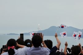 People watch the launch of South Korea’s homegrown Nuri space rocket in Goheung, South Korea May 25