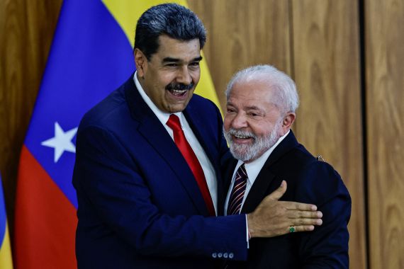 Venezuelan and Brazilian presidents Nicolas Maduro and Luiz Lula da Silva hug after a meeting in Brasilia
