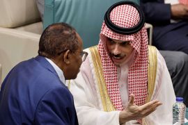 Saudi Arabia's Foreign Minister Faisal bin Farhan (right) speaks with Sudan's Ambassador to Egypt Abdelaziz Hassan Saleh during an emergency meeting of Arab League foreign ministers in Cairo, Egypt.