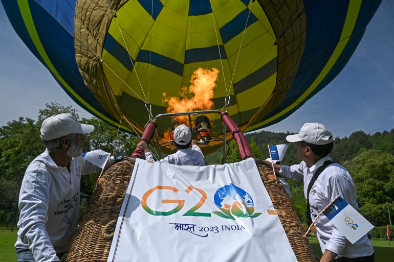 Workers inflate a hot air balloon during a function ahead of the G2O summit in Srinagar
