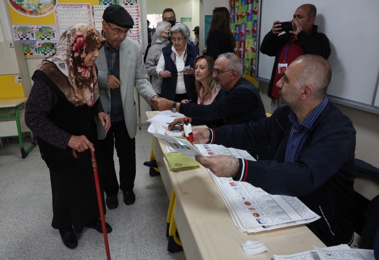 People arrive to vote at a polling station in Ankara