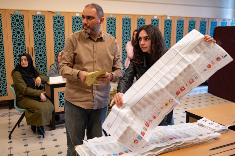 Election officials count ballots at a polling station in Istanbul, Turkey.