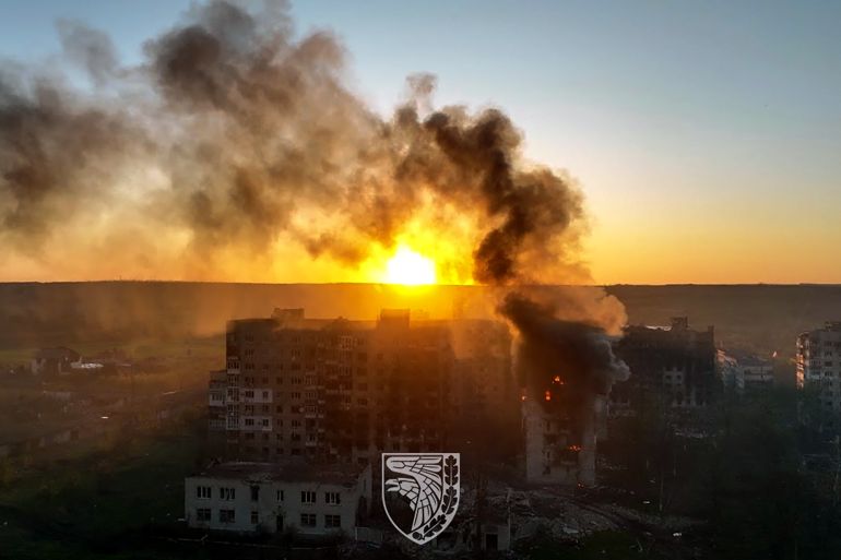 This undated handout aerial footage released on May 21, 2023, by the press service of the 93rd Kholodnyi Yar Mechanized Brigade of the Ukrainian Armed Forces shows an apartment block on fire in Bakhmut, Donetsk region, amid the Russian invasion of Ukraine.
