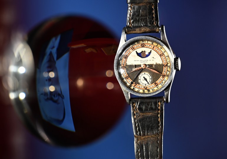 The Patek Philippe Ref 96 Quantieme Lune timepiece once owned by Aisin-Gioro Puyi, the Chinese Qing dynastys last emperor (L), is seen on display in Hong Kong on May 23, 2023 ahead of its auction in the territory on the same day. - The most expensive watch ever sold at auction was a super-complicated Patek Philippe Grandmaster Chime, which sold for US$31 million in 2019. (Photo by Peter PARKS / AFP)