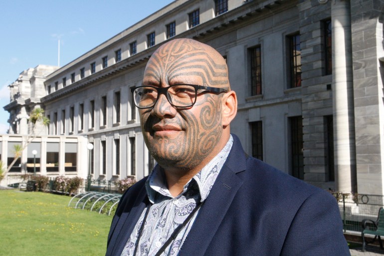 Maori Party Leader Rawiri Waititi outside the New Zealand parliament. He has traditional Maori face tattoos.