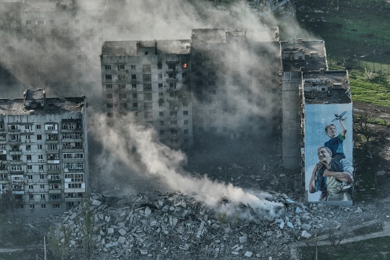 Smoke rises from a building in Bakhmut, the site of the heaviest battles with the Russian troops in the Donetsk region