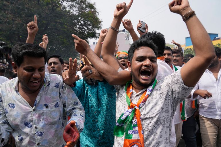 Supporters of opposition Congress party celebrate election results in the Karnataka state